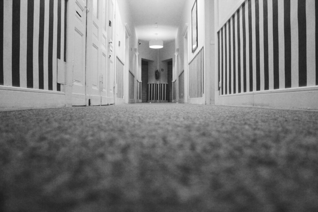 Long hallway of carpet freshly cleaned by Titan Carpet and Floor Care. Carpet cleaning Huntington Beach